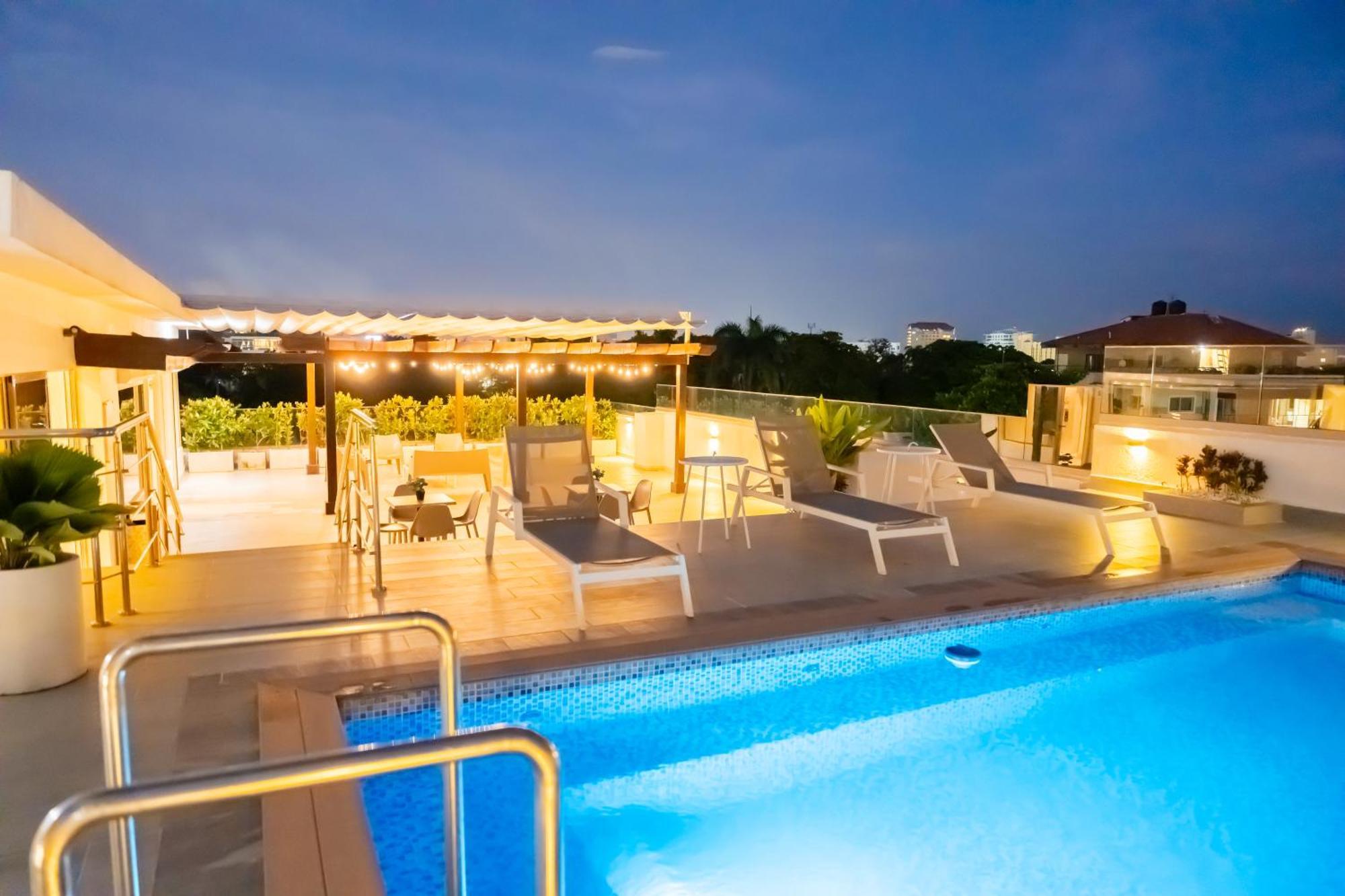 Hotel Stay Here Suites Santo Domingo Bagian luar foto